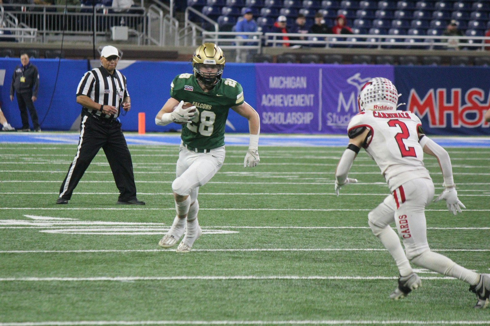 Monroe St. Mary Catholic Central’s Brock Cousino looks for first-down yardage after hauling in a pass from Ian Foster. Millington defeated Cousino’s squad in the Division 7 state title game, 24-0.