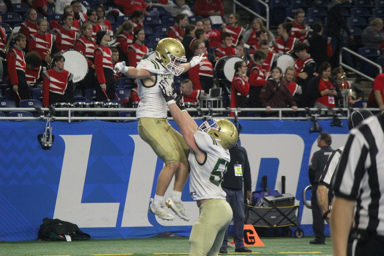 Offensive lineman Jake Gartin lifts running back Billy Collins up to celebrate another Notre Dame Prep touchdown. Collins’ 23-yard reception, his second score of the afternoon, gave the Fighting Irish a 28-0 lead over Frankenmuth.