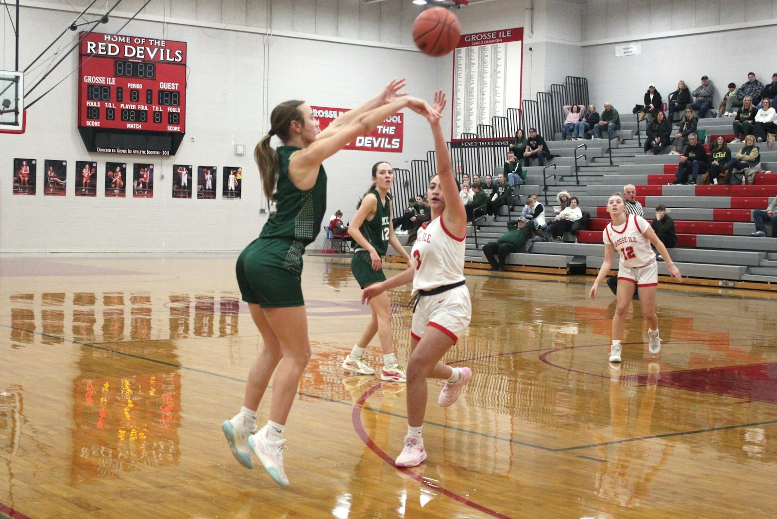 Bella LaFountain launches a three-pointer in the first quarter, when Monroe St. Mary Catholic Central jumped out to a 10-2 lead over Huron League foe Grosse Ile.