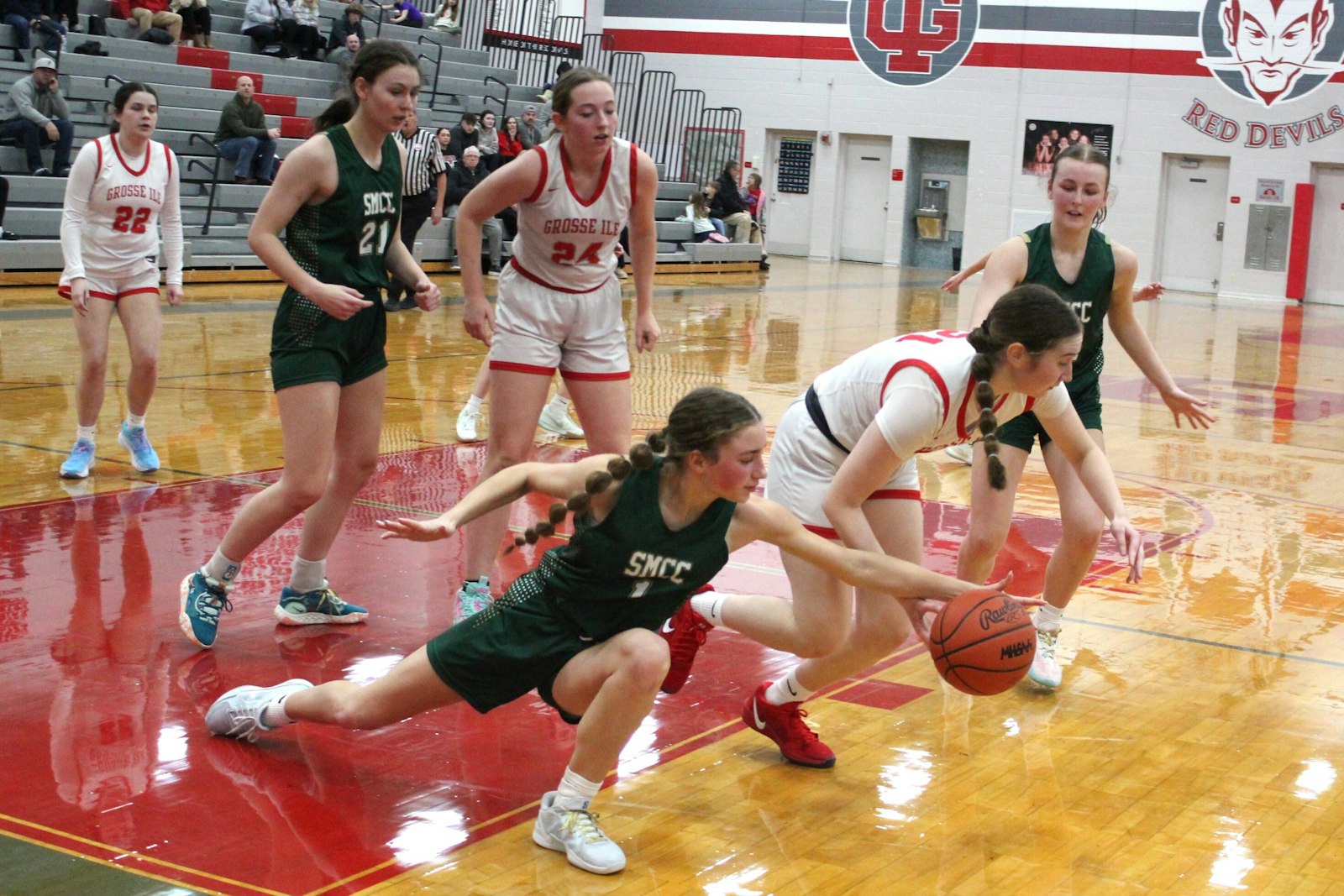 Adela Illes goes for a steal under the SMCC basket. The Kestrels stepped up their defensive efforts in the late stages of their 36-32 win at Grosse Ile on Jan. 23.