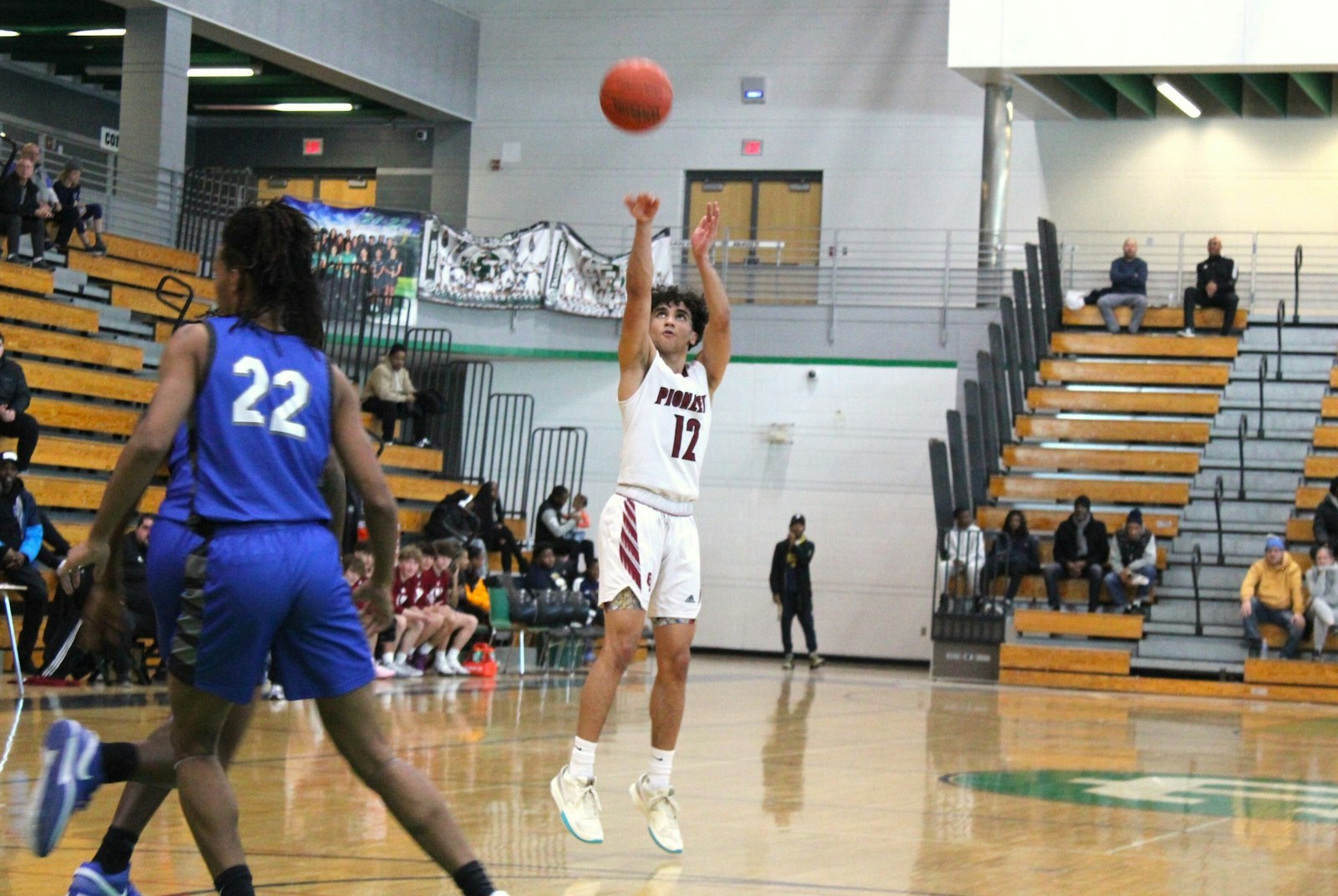 Derek Lesko lets a three-point attempt fly from the top of the key.