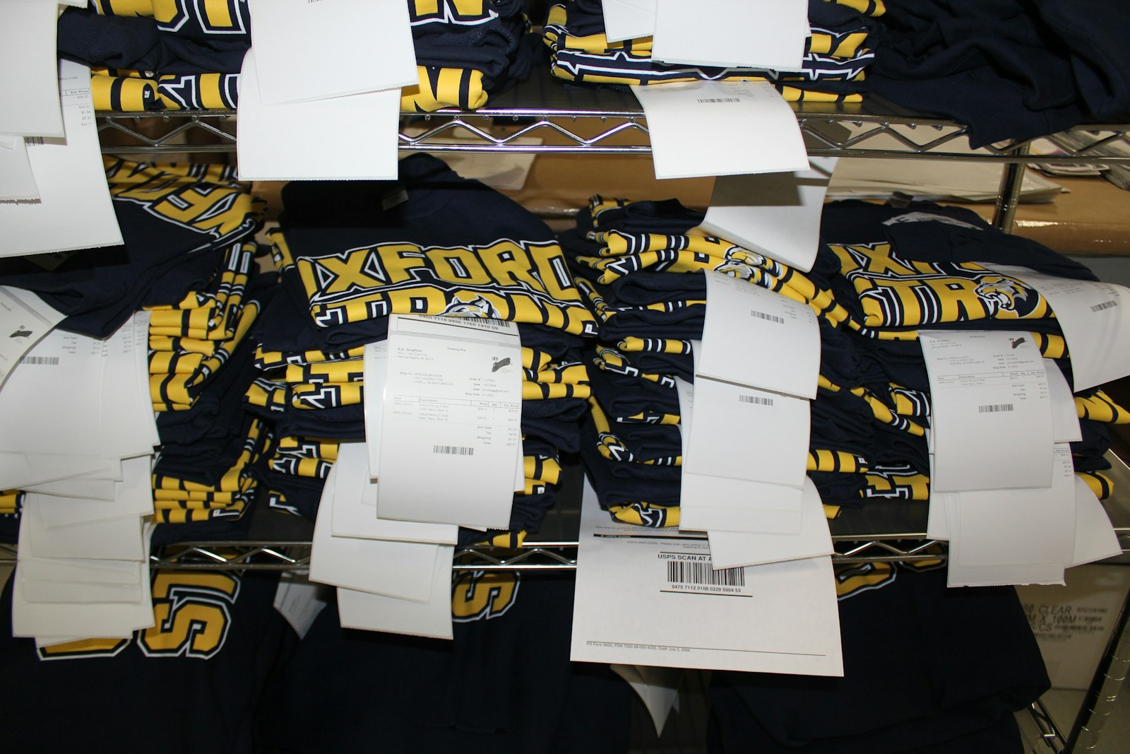 A supply of t-shirts in the E.A. Graphics plant will soon be delivered to those who support the Oxford Strong cause. The company has received orders from all across Michigan, and even beyond. (Photo by Wright Wilson | Special to Detroit Catholic)