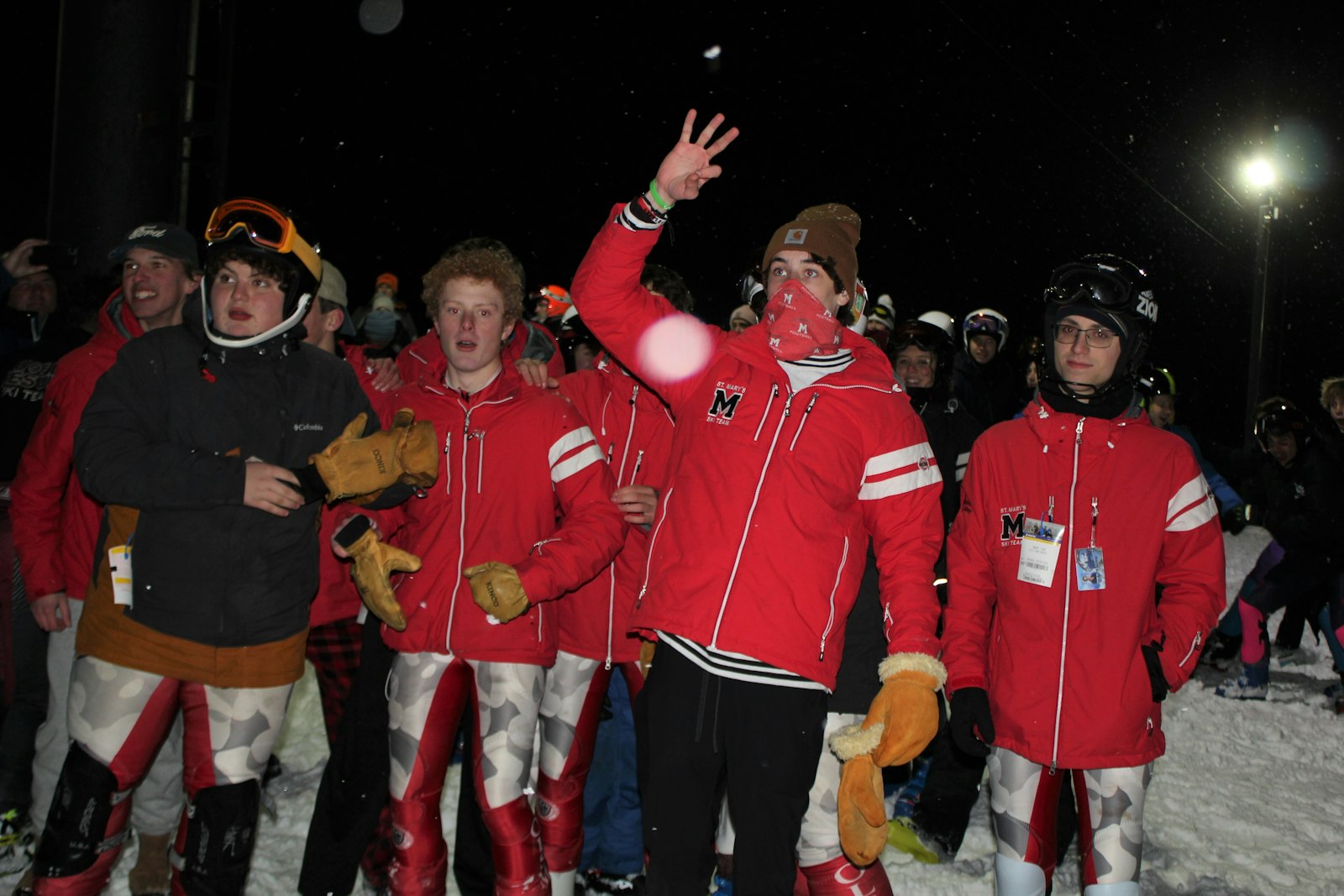 Orchard Lake St. Mary’s skiers react with elation after the final team scores are announced, giving the Eaglets the Catholic League ski championship for the third winter in a row.