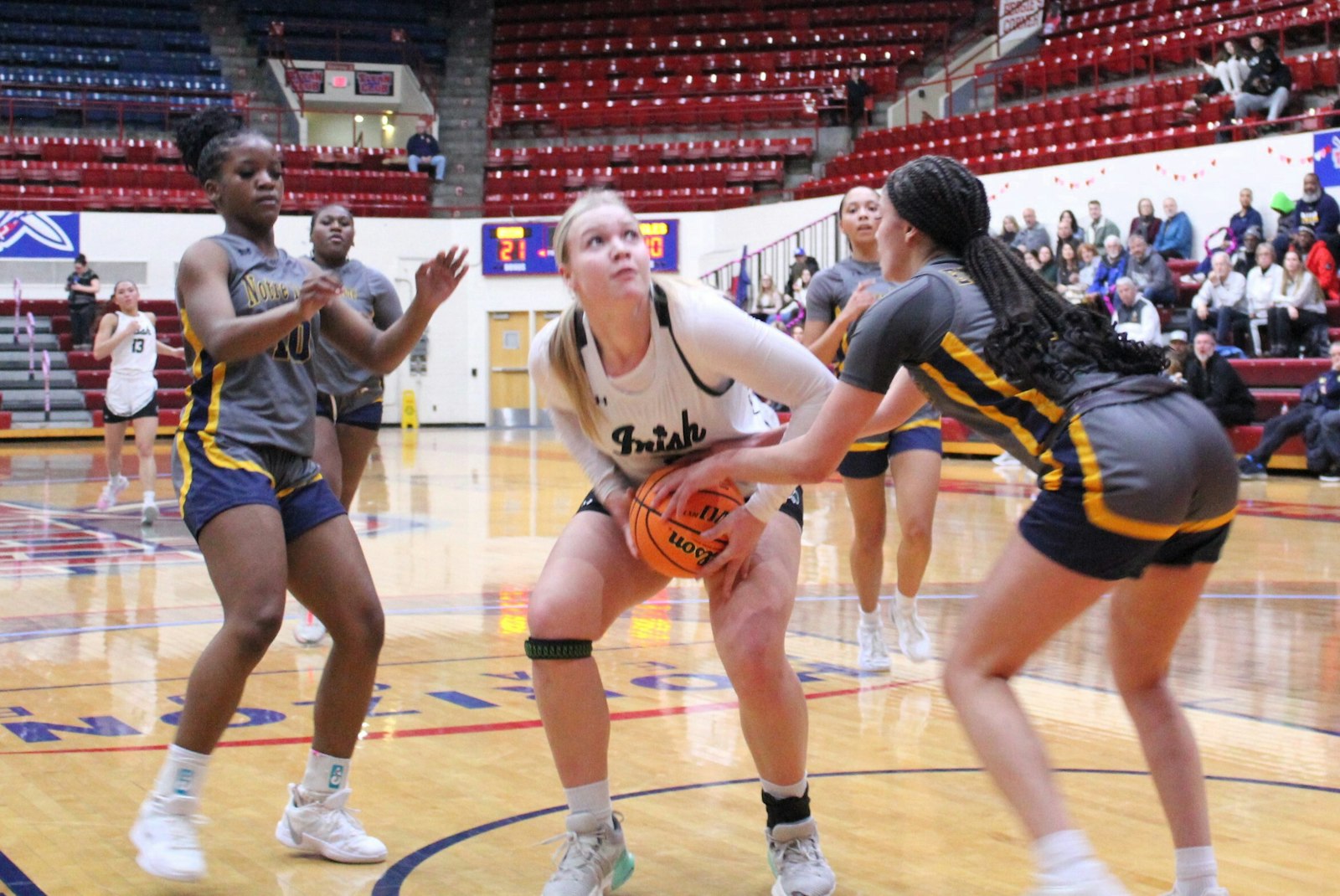 Surrounded by Notre Dame Academy defenders, Cora Williams looks to put up a shot. Williams led all scorers with 12 points in Fr. Gabriel Richard’s victory.