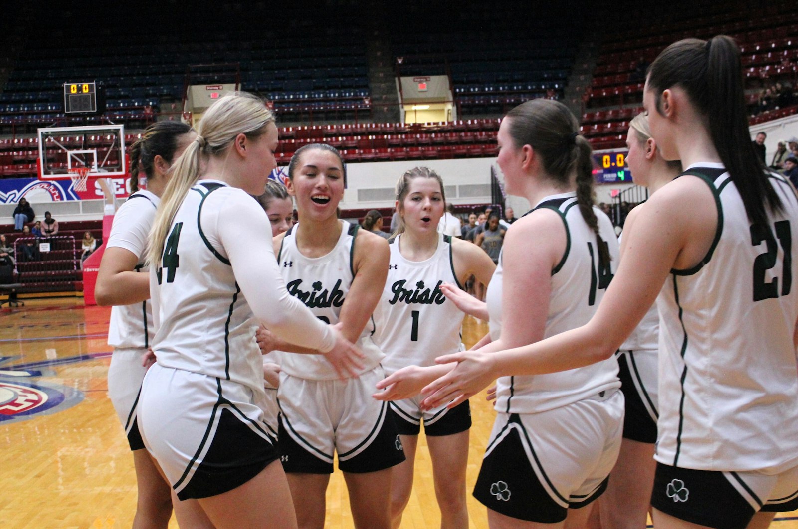 As the final seconds tick off the clock, Ann Arbor Fr. Gabriel Richard players celebrate their third consecutive Catholic League basketball championship.