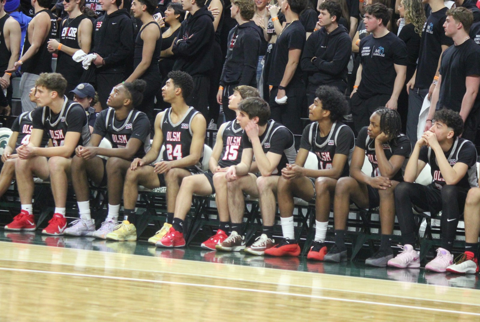 The glum faces of the Orchard Lake St. Mary’s bench players and student section tell the story in the final minute of the Eaglets’ 51-44 loss to East Lansing.