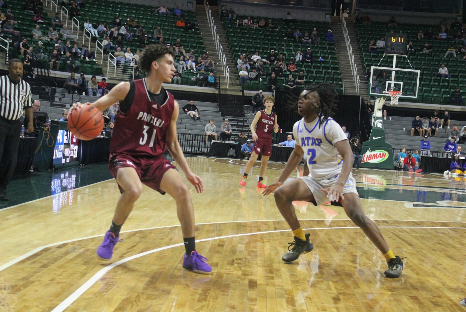 Bryce White looks for an opportunity to drive to the basket. White was one of five Gabriel Richard seniors scoring in double figures, leading the team with 18 points.