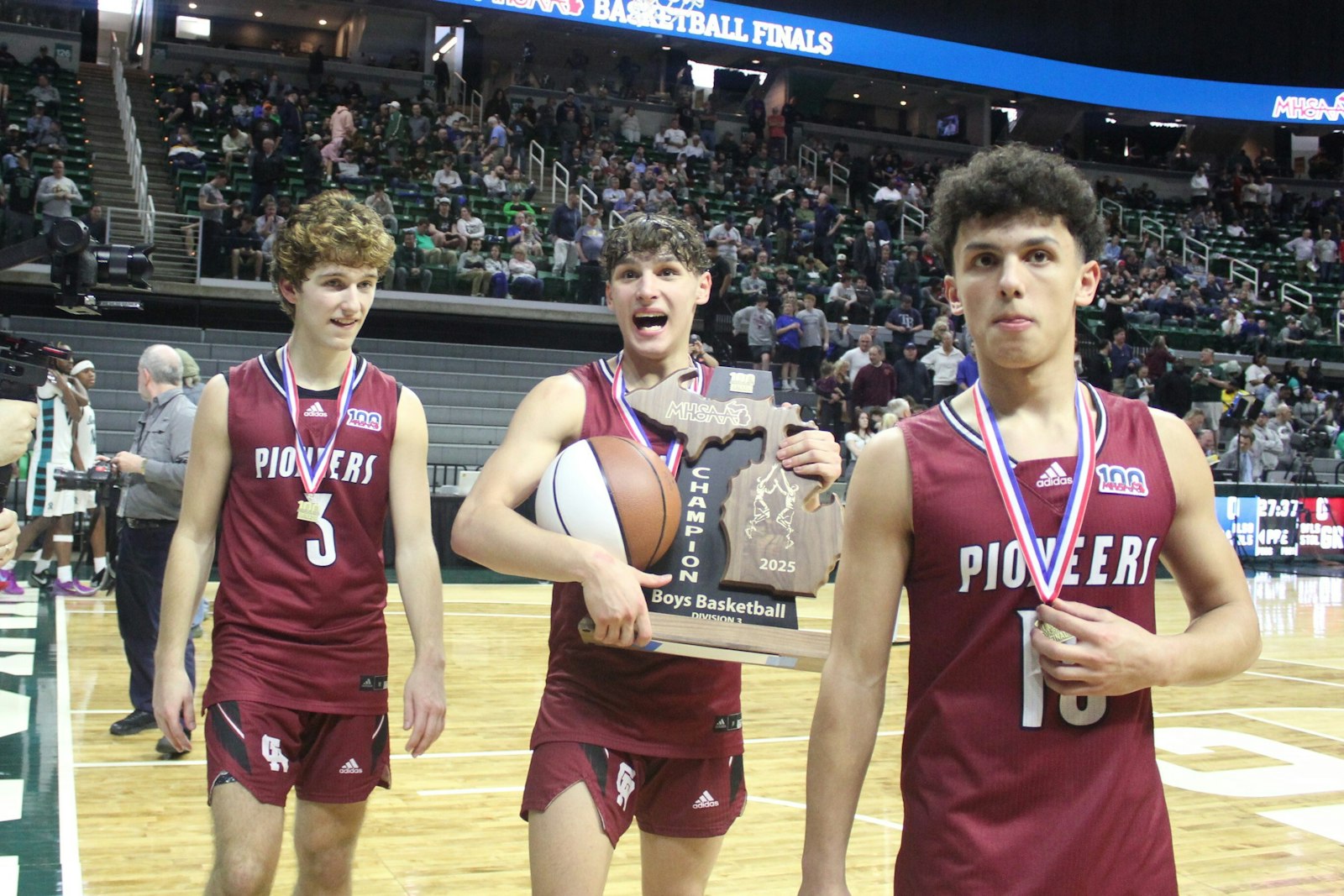 It’s a joyous moment for Luke Westerdale, Nick Sobush and Antonio Sobush, who leave the court at Michigan State University’s Breslin Center as state champions.