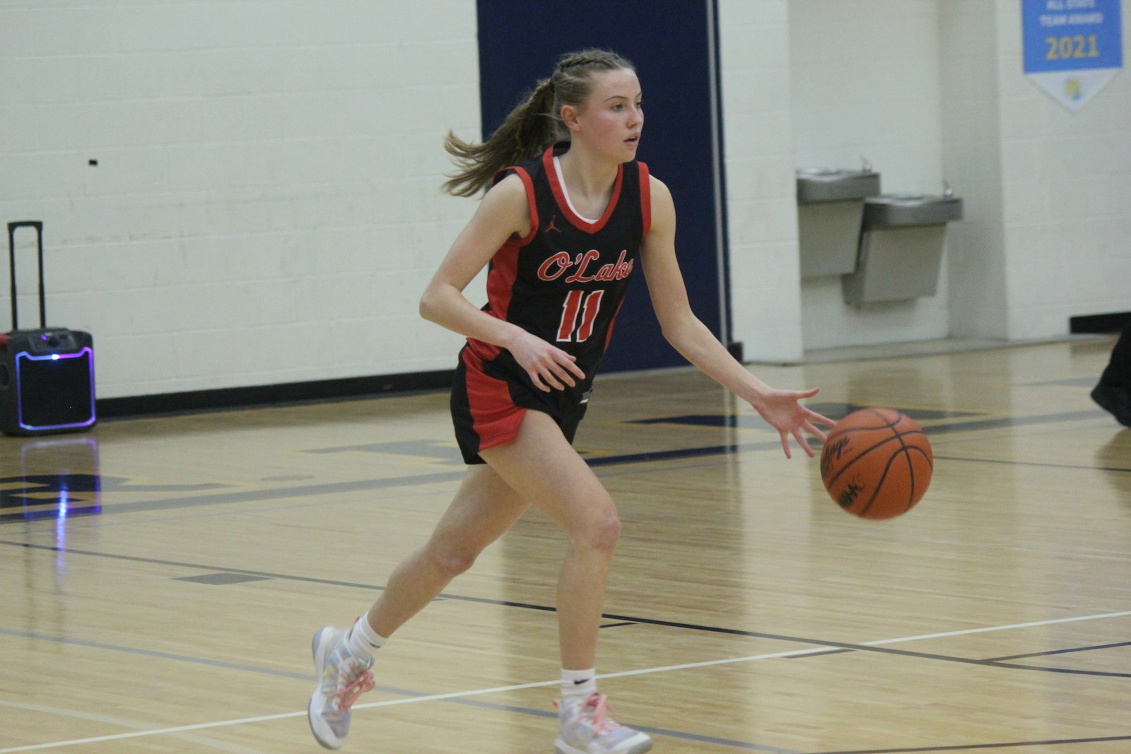 Orchard Lake St. Mary’s freshman guard Jessica Asmussen increases the tempo while bringing the ball up the floor. St. Mary’s extended its record to 8-0 with a 64-35 victory at Royal Oak Shrine.