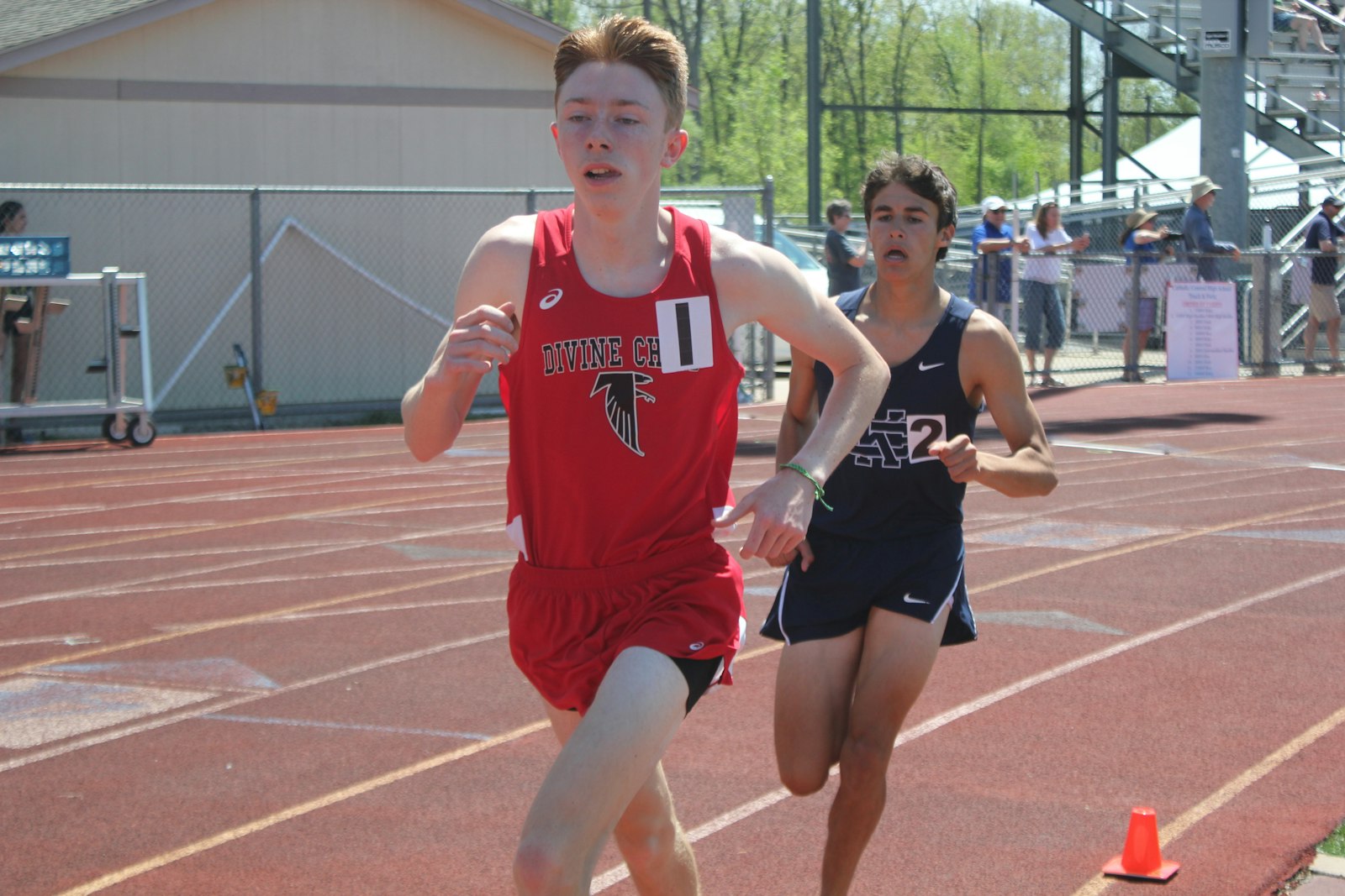 In the 1600-meter run, Dearborn Divine Child’s Michael Hegarty holds off a challenge from Bloomfield Hills Cranbrook’s Solomon Kwartowitz. Hegarty won the race by less than a second.