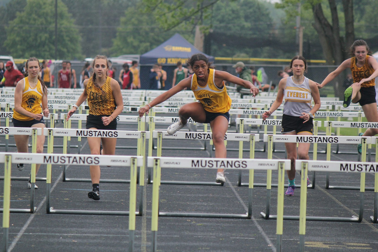 Royal Oak Shrine’s Charlotte Terbrack approaches the final jump in the 100-meter hurdles. She won both the high hurdle and low hurdle races during the Catholic League Cardinal Division track and field championship meet on May 25.