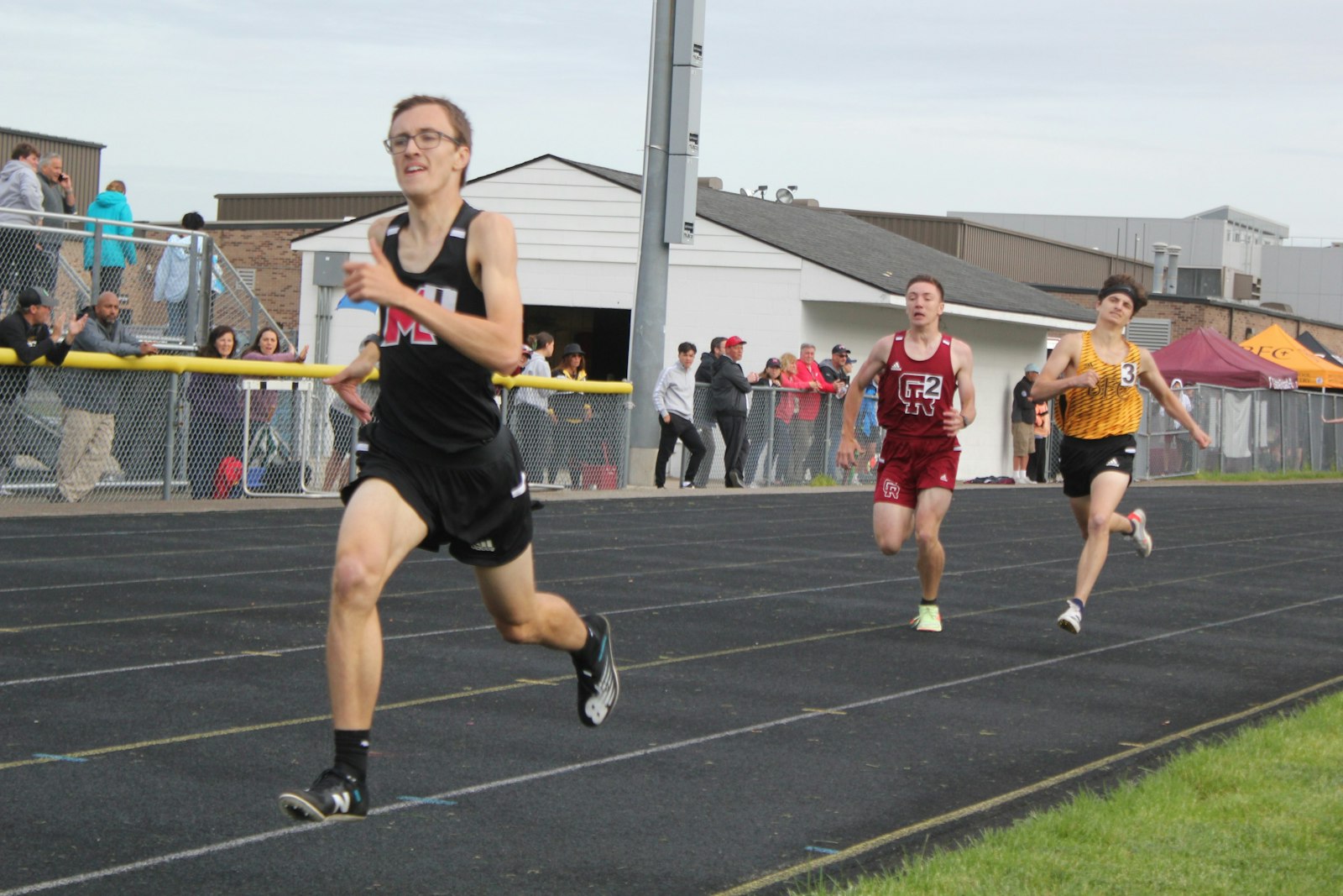 Marine City Cardinal Mooney sophomore Tyler Lenn holds off a late charge from Riverview Gabriel Richard’s Alex Meszaros and Bishop Foley’s Max Mader to win the 800-meter run. Earlier, Lenn won the 1600 meters.