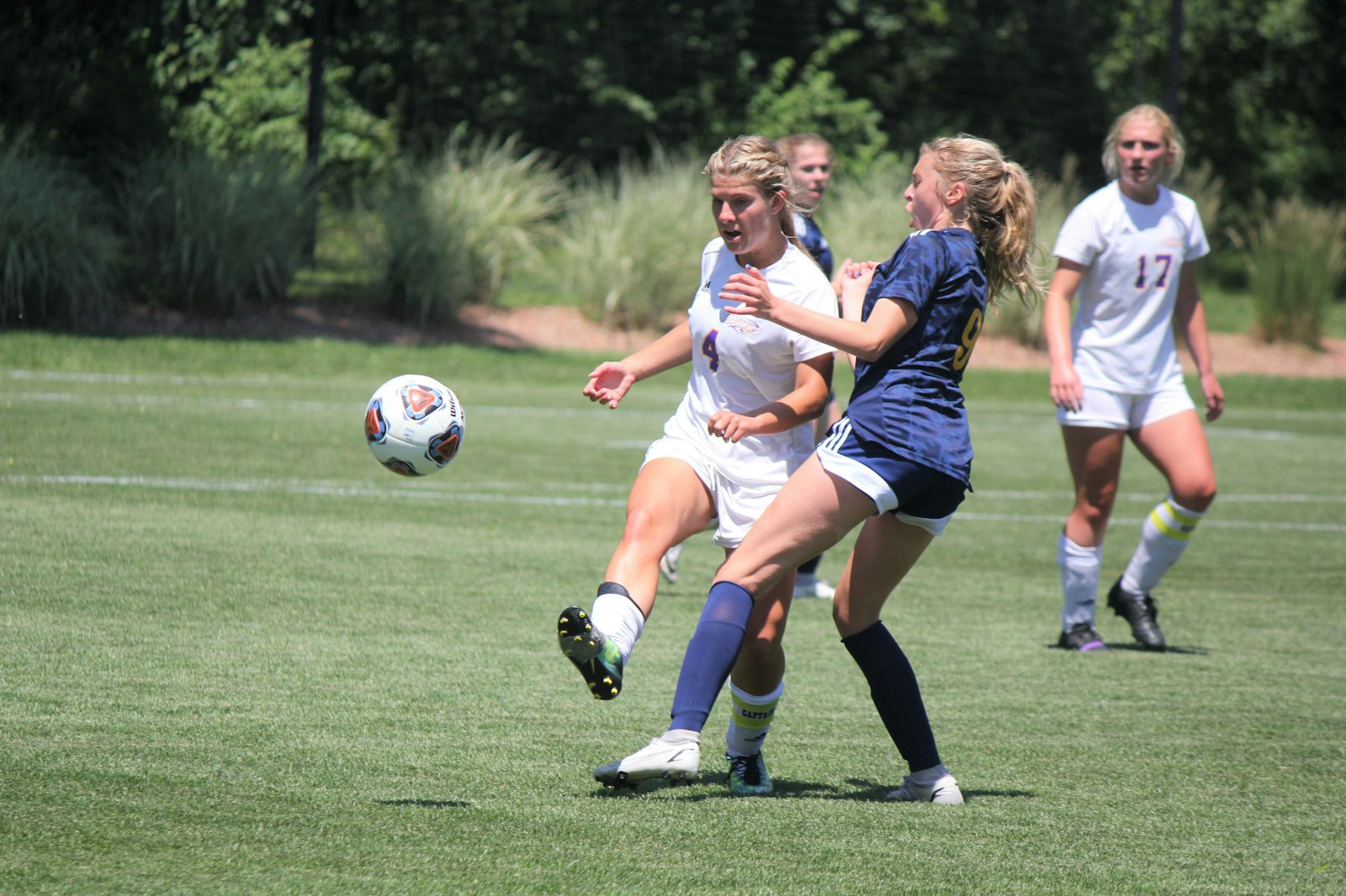 Senior Claire Plaskey collides with Kalamazoo Christian’s Ellie Batts during the second half of Shrine’s 1-0 state championship win.