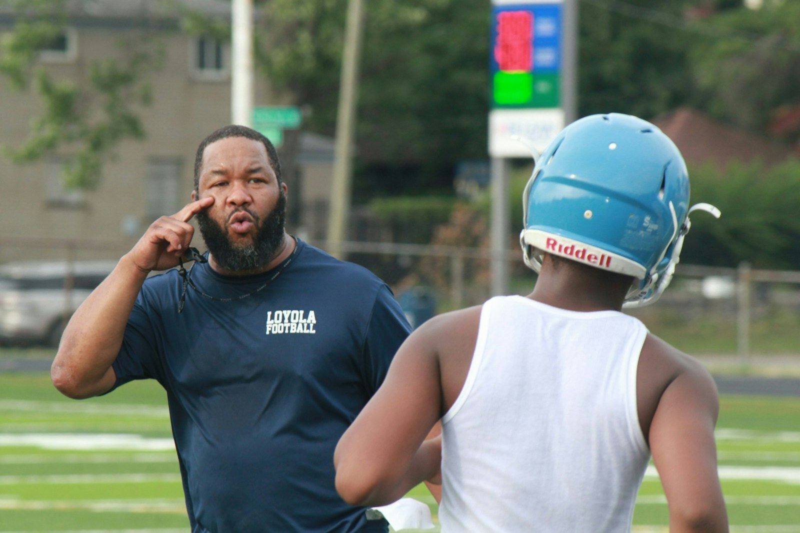 Coach Terrance “Tee” Sims instructs one of his Loyola players during a 2022 practice session at University of Detroit-Mercy. Loyola was picked to win the Intersectional-1 title this fall. (Photo by Wright Wilson | Special to Detroit Catholic)