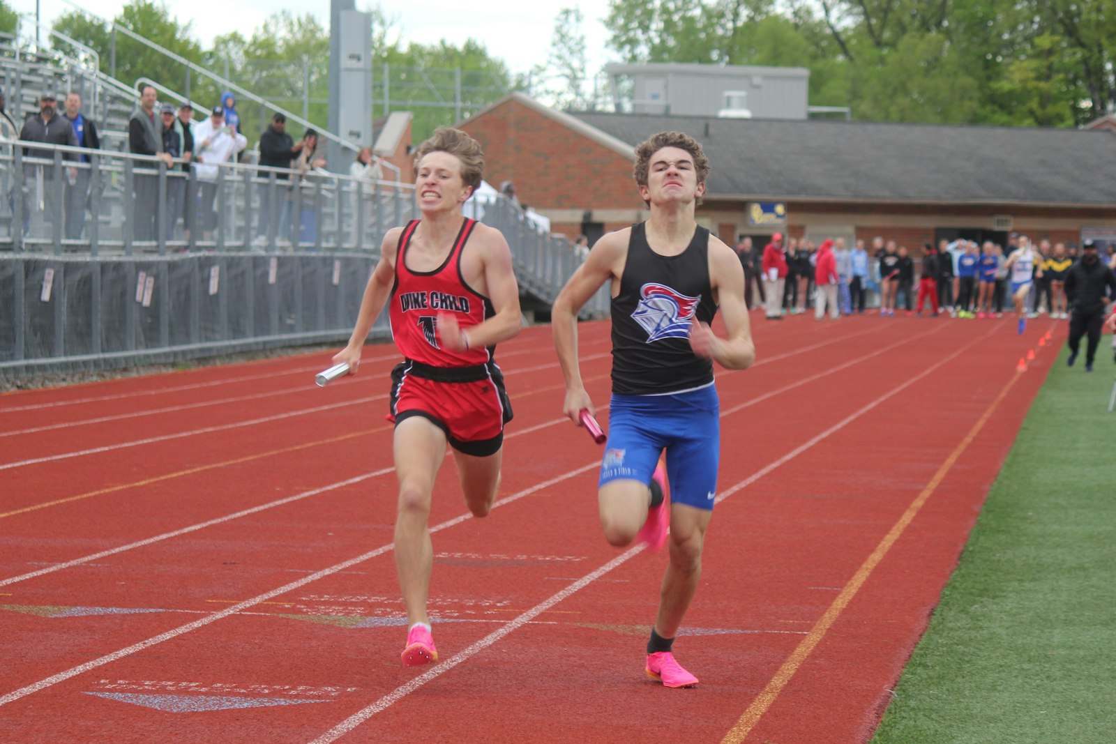 Divine Child’s Colin Murray and Toledo St. Francis de Sales’ William Dwyer go toe-to-toe in the final stretch of the 4x800 meter relay. St. Francis won the race by a slim margin of 2/100ths of a second.