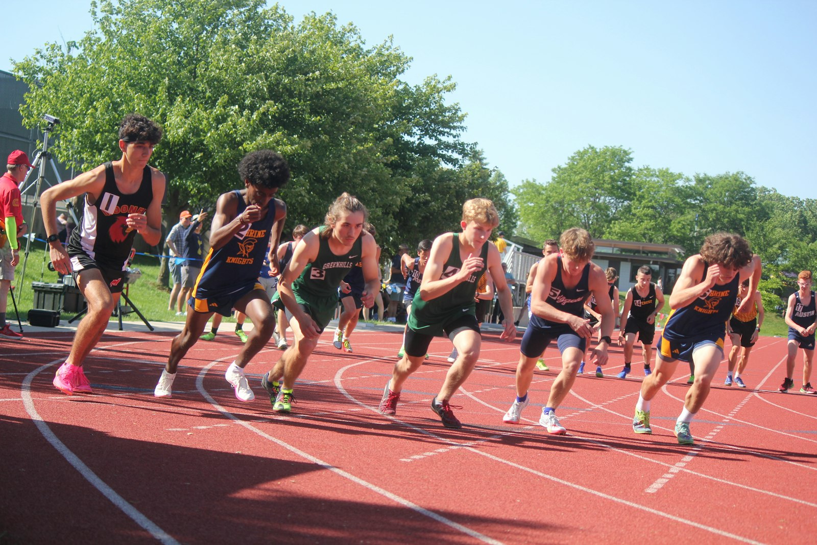 Runners take off from the starting line in the boys’ 1600 meter run. Royal Oak Shrine’s Abenezer Cerone (second from left) was the race winner, edging Marine City Cardinal Mooney’s Matthew Zammit (left).