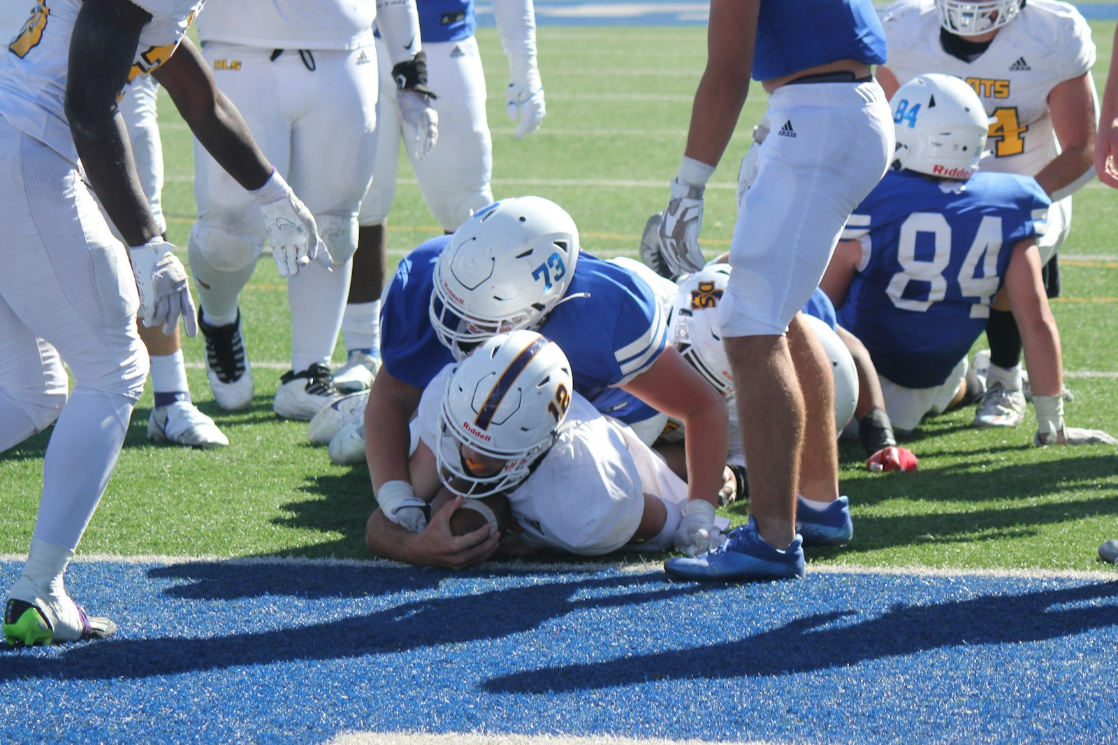 Quarterback Brady Drogosh falls across the goal line for a fourth-quarter score during De La Salle’s 28-0 victory over Catholic Central. This play gave the Pilots a three-touchdown lead.