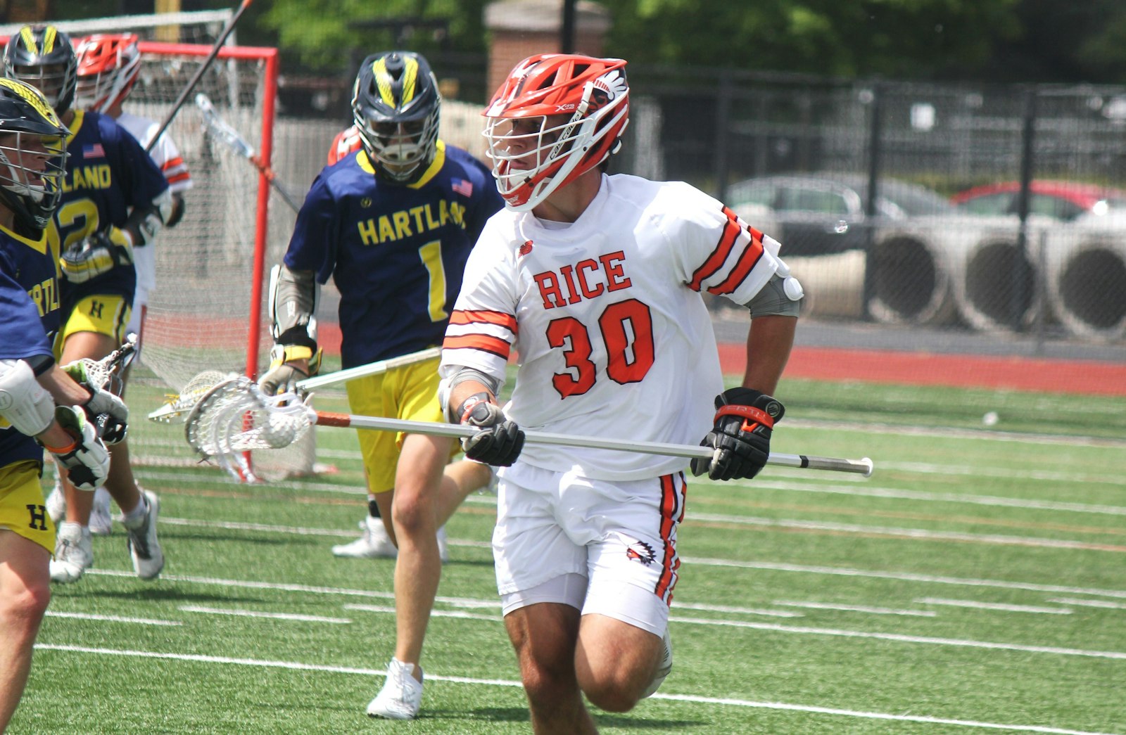 Birmingham Brother Rice's Ben Waechter passes the ball forward and several Hartland defenders give chase.  Hartland upset Brother Rice in the state semifinals 11-10.
