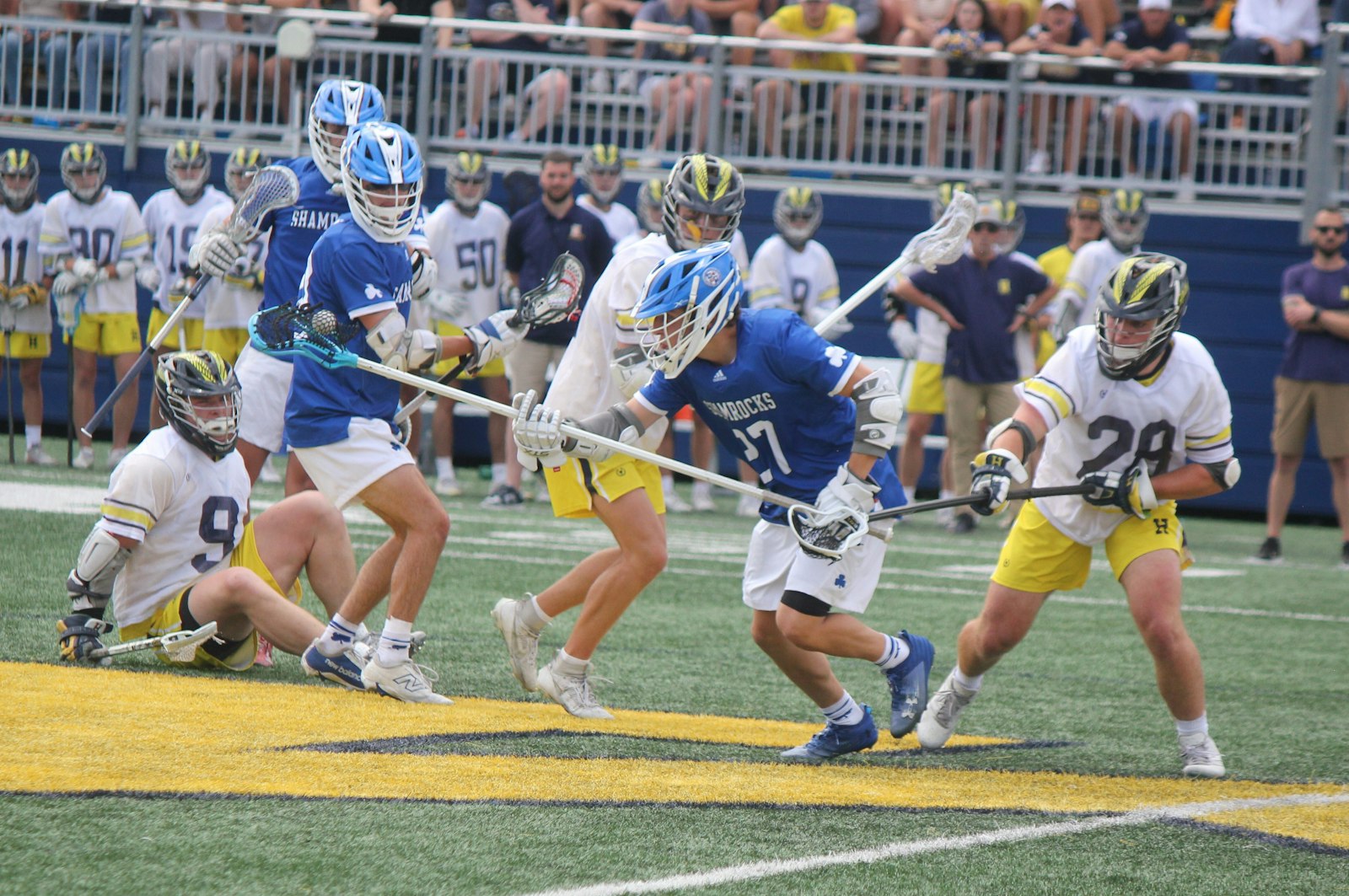 Catholic Central's Joey Ramirez takes the ball on the ground after a midfield skirmish causes a Hartland turnover.