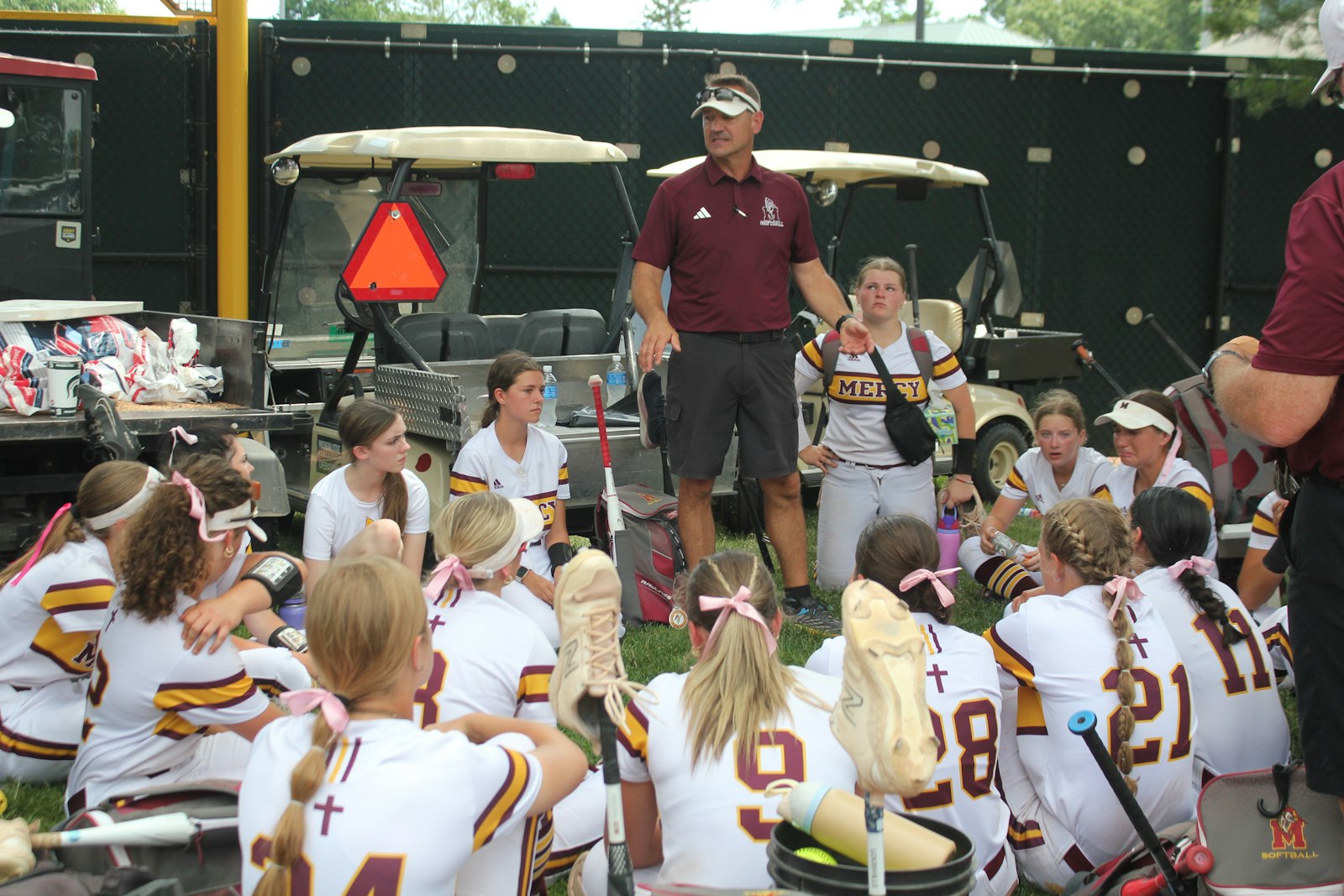 Head coach Corey Burras has the unenviable task of delivering the post-game talk to his Farmington Hills Mercy team after the Marlins’ season ended one step short of the state championship game.