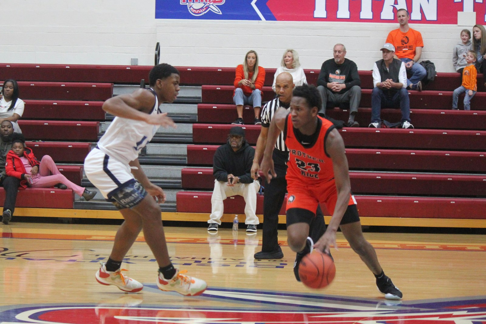 Bloomfield Hills Brother Rice forward Curtis Williams moves on Detroit Voyageur’s Dimaunyae’ Smith-Powe. The Warriors defeated their non-league foes 78-52 in the Calihan Challenge.