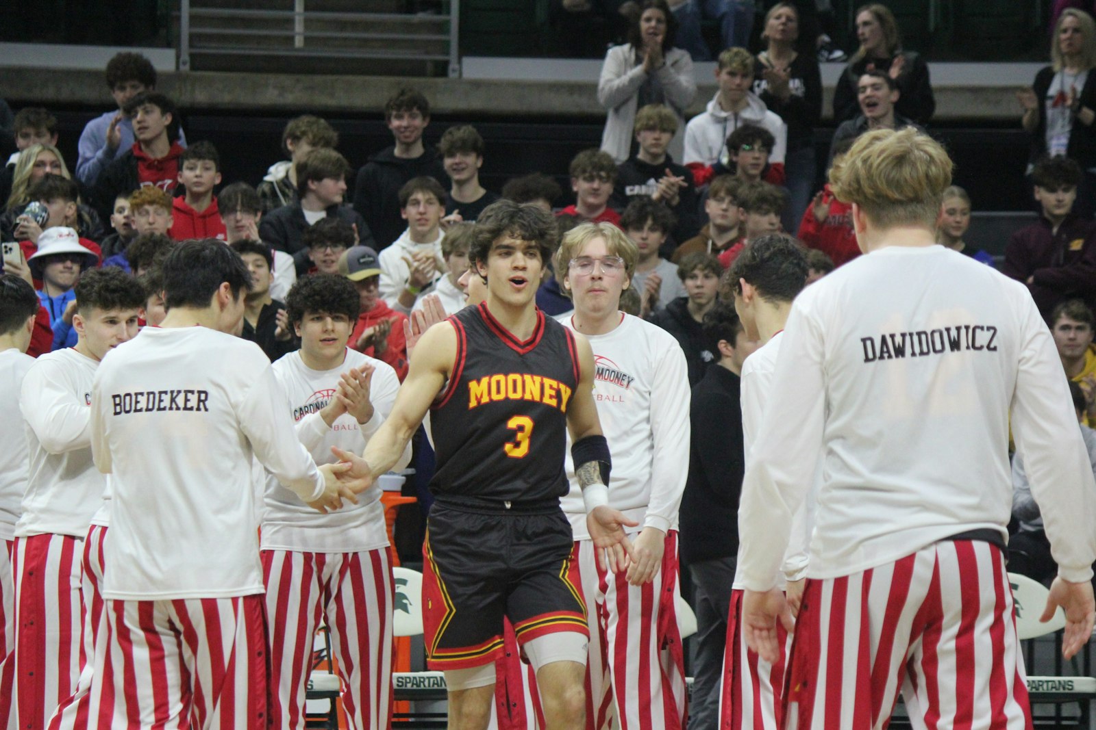 Guard Trent Rice, Cardinal Mooney’s leading scorer this season, is introduced as part of the starting lineup for the Cardinals’ semi-final tilt with Munising. He led the team with 19 points in the game.