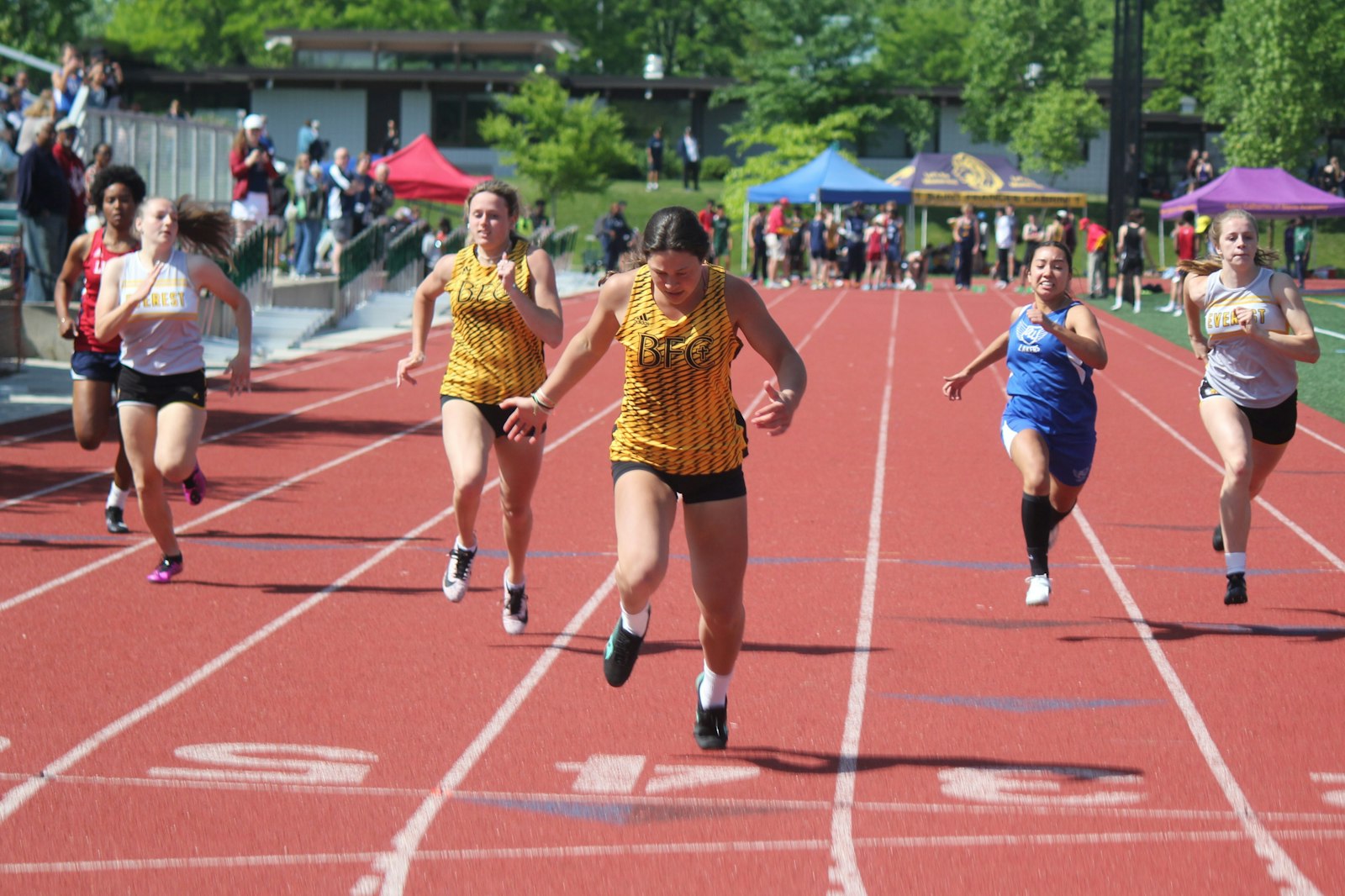 Madison Heights Bishop Foley’s Alyssa Samartino wins the 100 dash. She also claimed first in the high jump, was second in the 200, and ran on the Venture’s first-place 4x100 relay.
