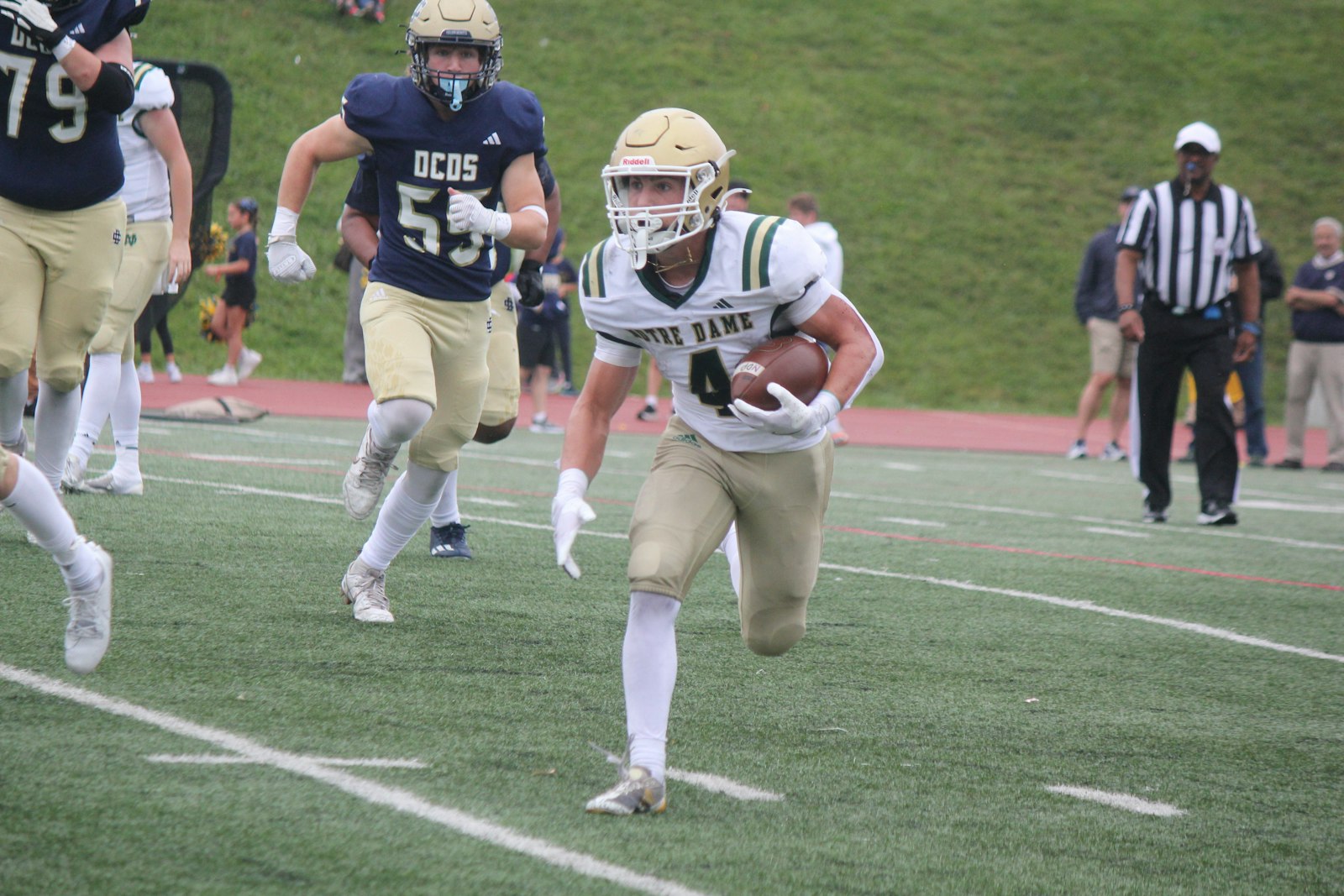 Billy Collins looks for running room in the first half of Pontiac Notre Dame Prep’s victory over host Detroit Country Day. Collins rushed for 70 yards and caught two touchdown passes from Sam Stowe.