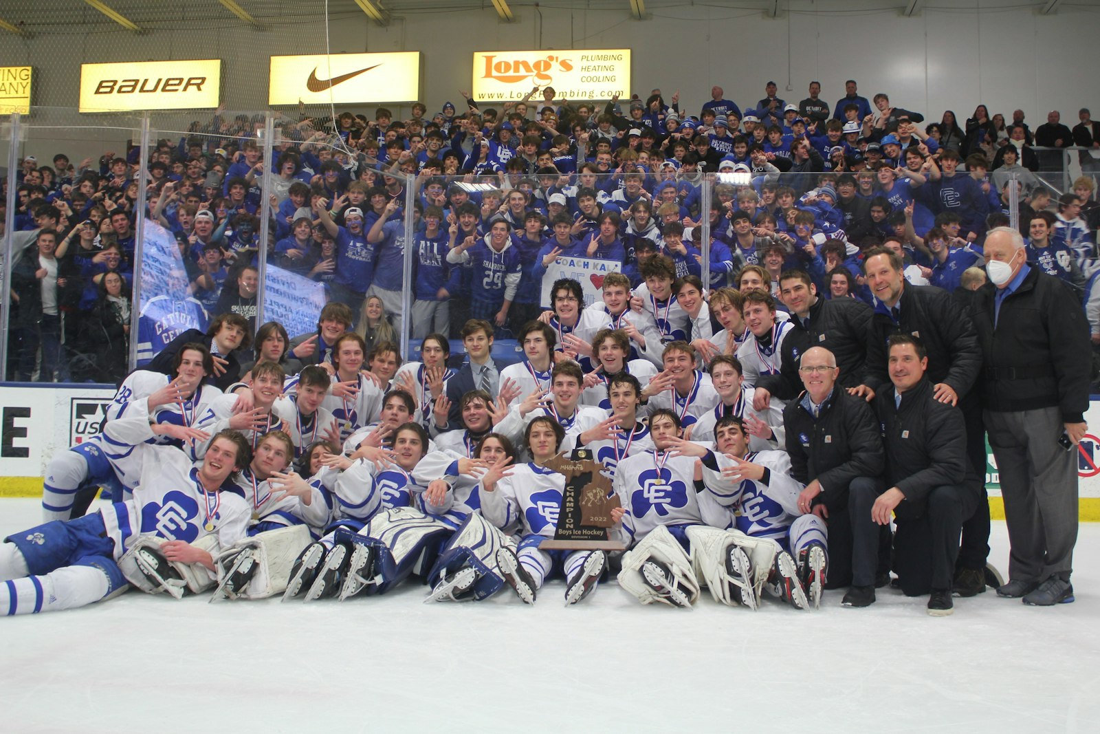 In what seems to be an annual tradition, Catholic Central hockey players gather with the state championship trophy in front of their fan section at Plymouth’s U.S.A. Hockey Arena. The Shamrocks downed Brighton, 5-1.