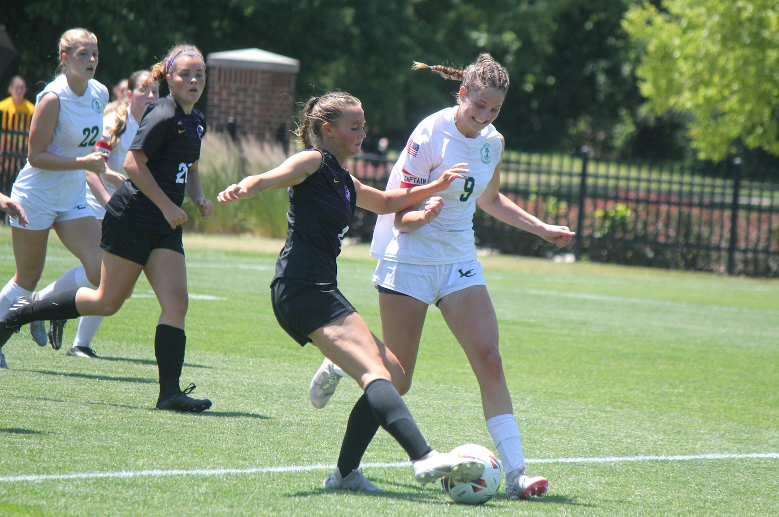 Lumen Christi captain Kathleen Doane tries to prevent Kalamazoo Christian’s Emily Gorton from advancing the ball.